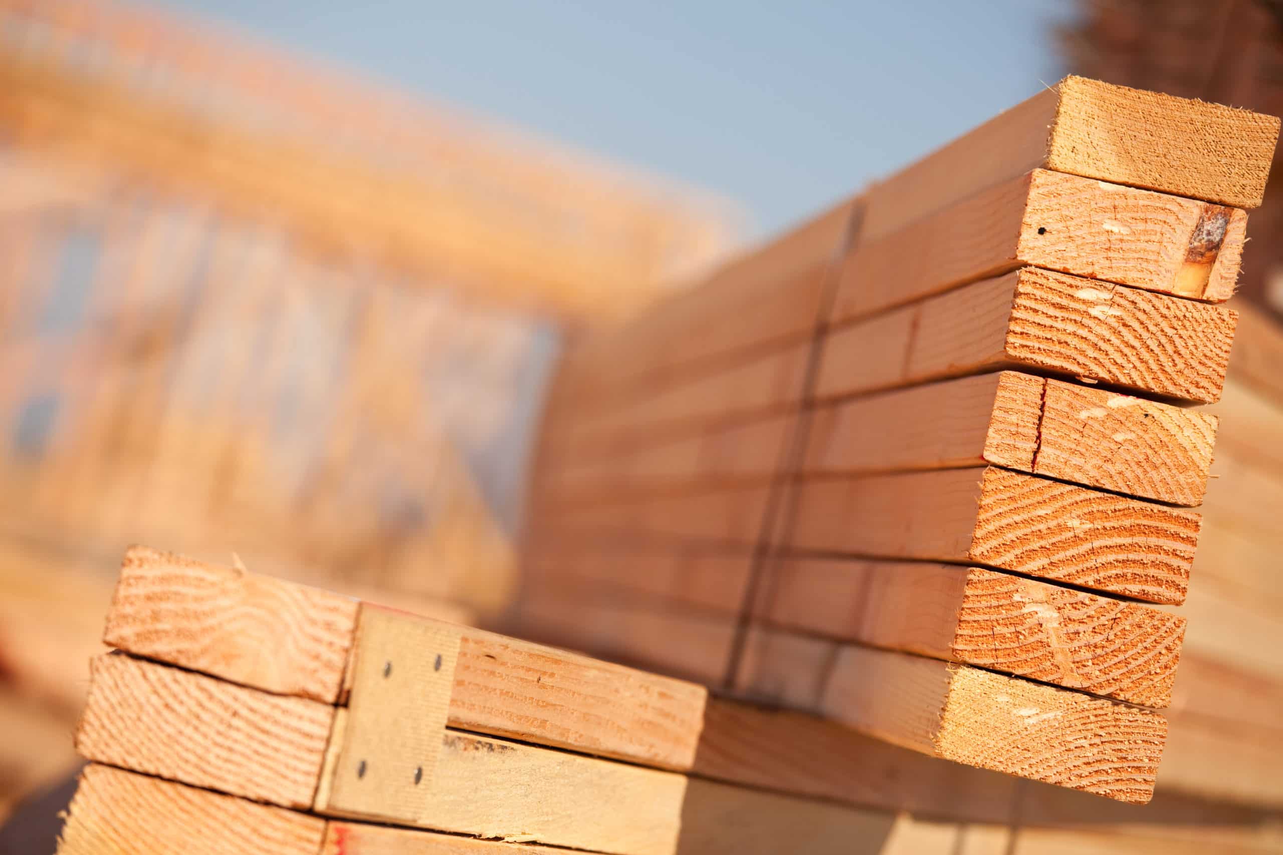 Stack of Building Lumber at Construction Site with Narrow Depth of Field. Building Materials