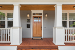 covered porch showing new wood front door of home