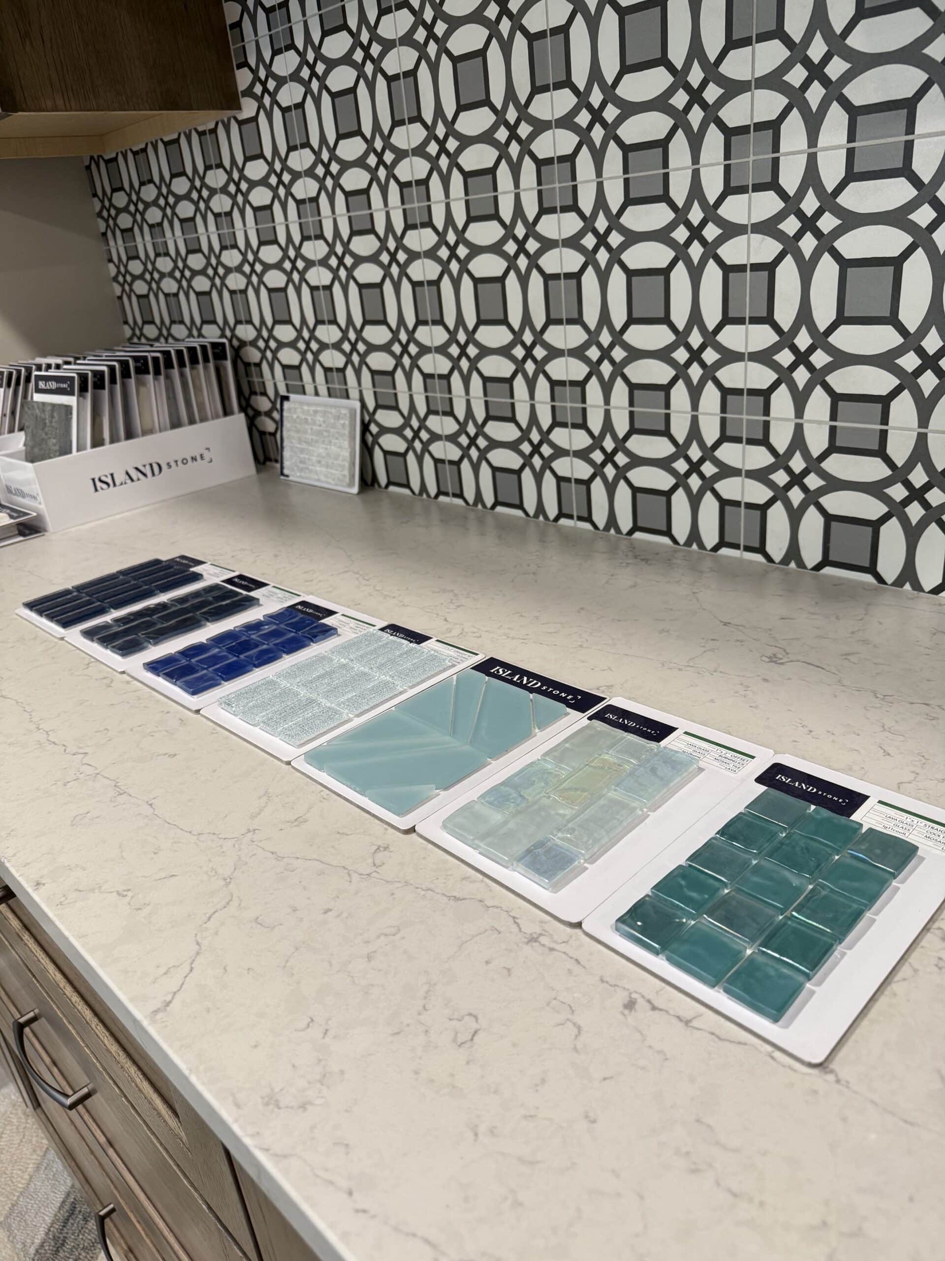 Samples of blue backsplash on light counter